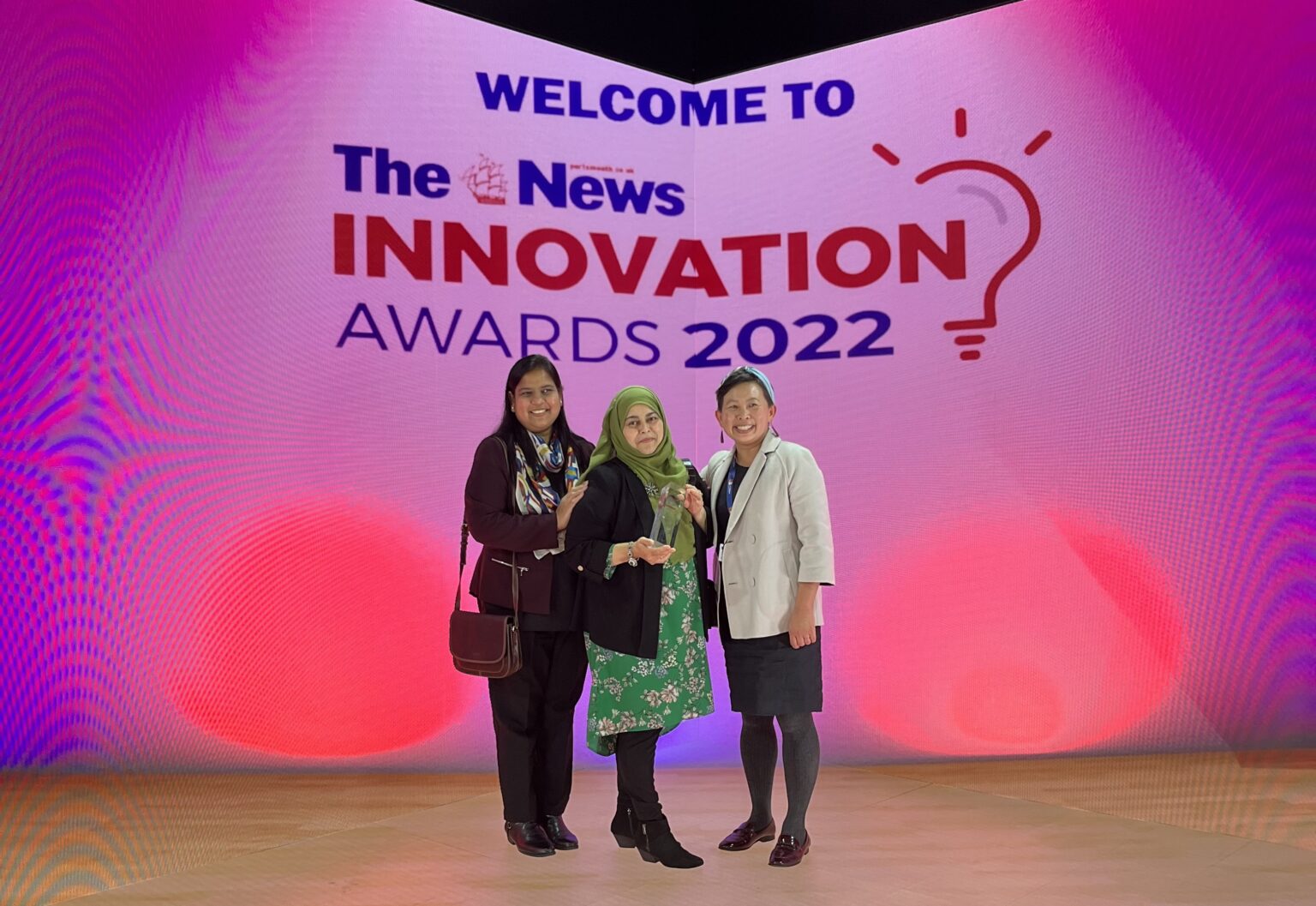 Work Better Innovations Co-founders Anita David and Dr Bonny Ling are joined in the middle by WBI Advisor and the Health Inequalities Lead for Portsmouth NHS, Shipa Ahmed Khan, for a photo celebrating the award.